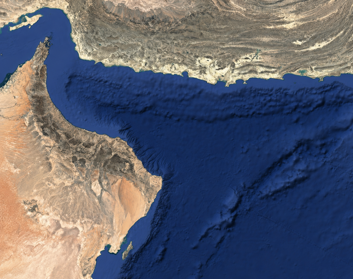 Unlabeled satellite-style Gulf of Oman terrain based on the reference map